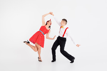 Full body portrait of two young funny partners choreography training isolated on white color...