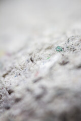 Fototapeta premium Extreme close up of old gray handmade paper clay with a structure and rough texture. Paper recycling. Selective focus, shallow depth of field.