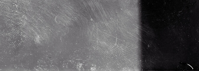 Blank grained film strip texture background with heavy grain, dust and light leak