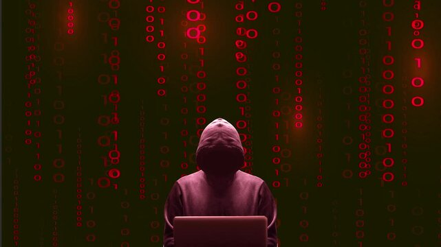 Silhouette rouge centr&eacute;e du cybercriminel devant son &eacute;cran d'ordinateur portable sur fond de donn&eacute;es binaires anim&eacute;es rouges
