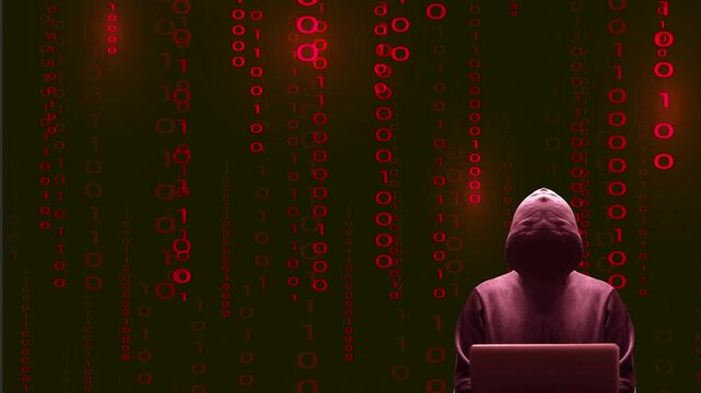 Silhouette rouge d&eacute;cal&eacute;e sur la droite du cybercriminel devant son &eacute;cran d'ordinateur portable sur fond de donn&eacute;es binaires anim&eacute;es rouges
