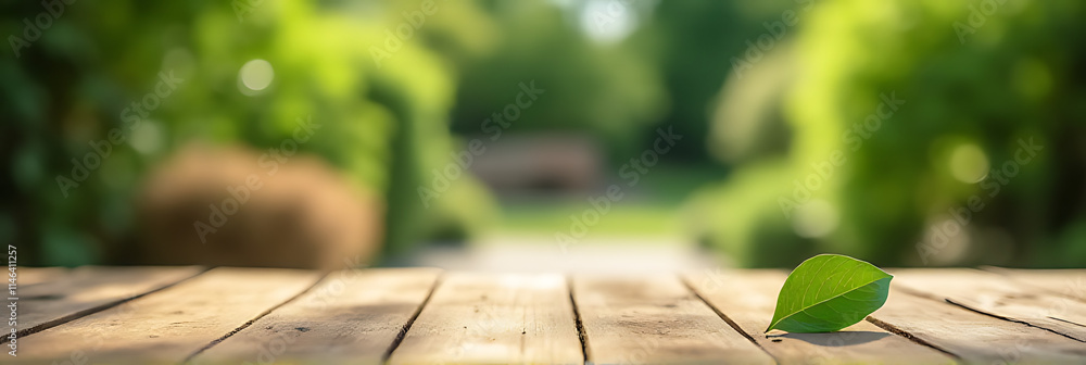 Aufkleber A real wood table top with a blurred leaf in the background amidst a garden setting is shown in sharp focus._00002_