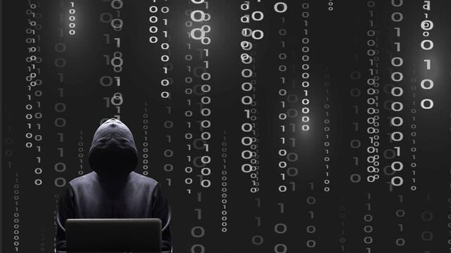 Silhouette noire d&eacute;cal&eacute;e sur la gauche du cybercriminel devant son &eacute;cran d'ordinateur portable sur fond de donn&eacute;es binaires blanches