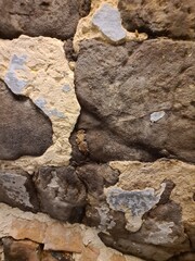 minimalistic background / wall paper design - close up texture of a stone wall - photography