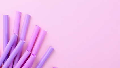 A collection of colorful purple straws arranged on a pastel background adds a playful touch to party and celebration settings._00002_