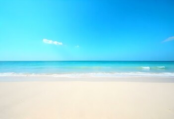Obraz premium A sandy beach with a clear blue ocean and sky in the background