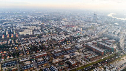 Fototapeta premium Austria, Vienna: Top Aerial View of Quiet Residential Areas in Districts 21 and 22. A peaceful perspective showcasing the serene neighborhoods of the Austrian capital