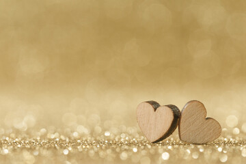 wooden hearts on bokeh background