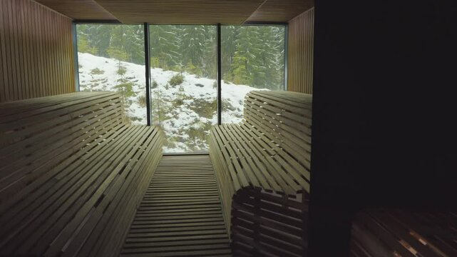 Sauna with a glass wall and mountain views