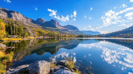 Fototapeta premium Serene Mountain Lake Under Clear Blue Sky with Reflection