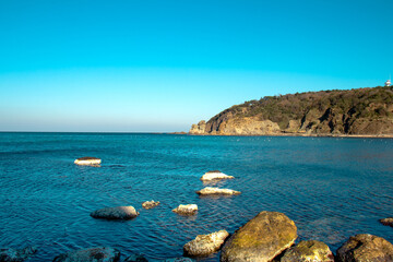 Fototapeta premium Landscape. Blue sea and sky. Rocky coast, nature view. Unspoiled beaches of Istanbul. Copy space.