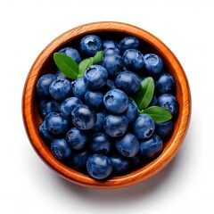 Fototapeta premium Blueberries in a wooden bowl, white background and rich blue color, fresh berries and healthy superfoods