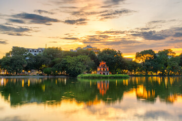 Hoan Kiem Lake ( Ho Guom) or Sword lake in the center of Hanoi in cinematic sunset sky.