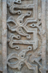 A historical building framed with artistically carved stonework. Architectural detail from the...