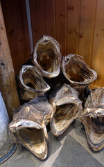 Arctic Cod stockfish on the floor at the corner of the food shop for interior decoration, centuries old methods of drying fish in the wind, Norway food industry