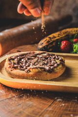 Esfiha or mini chocolate pizza with banana and cinnamon