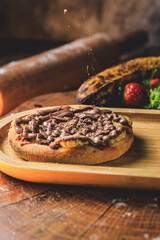 Esfiha or mini chocolate pizza with banana and cinnamon