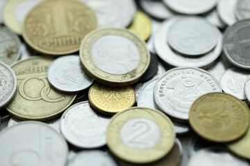 Big pile of different coins from various currencies and different countries around the world. Currency exchange