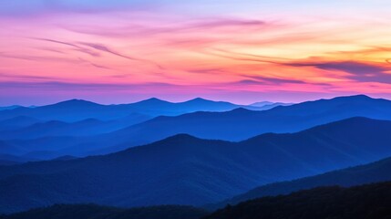 Obraz premium Serene mountain landscape at sunset, showcasing vibrant colors and layered hills.