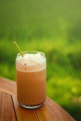 A glass of chocolate milkshake.