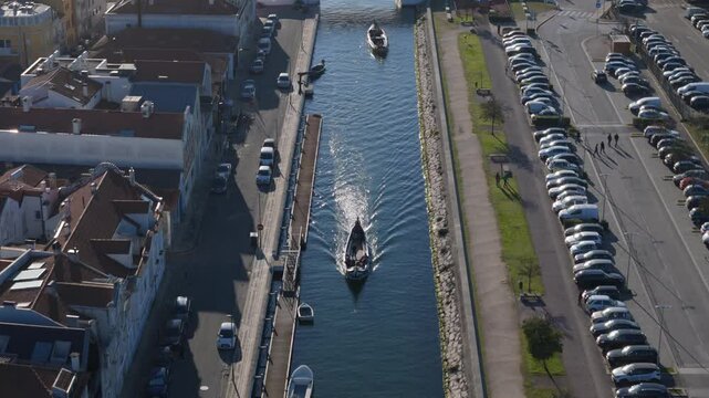 Beautiful aerial view of Aveiro city in Portugal. Aveiro Water canal of Ria de Aveiro with typical boats and tourists