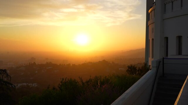 Breathtaking sunset view over Los Angeles from Griffith Observatory with vibrant colors.