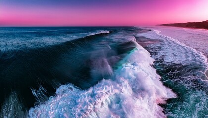 Aerial view of a wave cresting with white foam. for surfers in the black and pin background