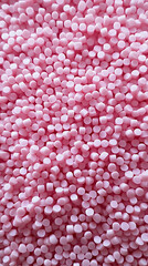 Fototapeta premium Pink Plastic pellets Background Close-up Plastic granules Polymer plastic beads resin polymer