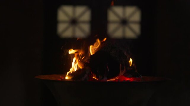 Sacred Eternal Flame in Zoroastrian Fire Temple. Atash Behram at the Fire Temple of Yazd in Iran, Established 1934. Dance of fire symbolizes sacred traditions, and struggle between light and darkness.