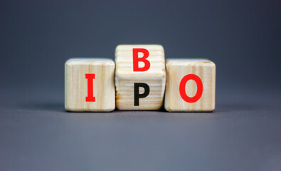 Initial public or bond offering symbol. Concept words abbreviation IPO or IBO on wooden block....