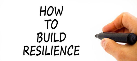 How to build resilience symbol. Concept words How to build resilience on beautiful white paper. Beautiful white background. Businessman hand. Business and how to build resilience concept. Copy space