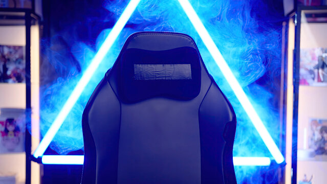 Empty gaming chair template in blue neon light cyberspace with smoke
