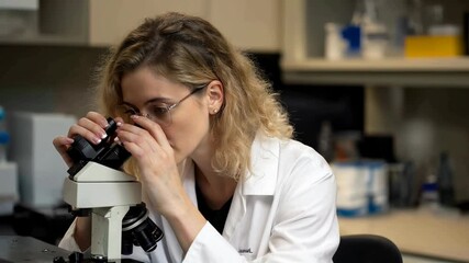 Scientist Analyzing Samples in Laboratory Footage for Research Purposes