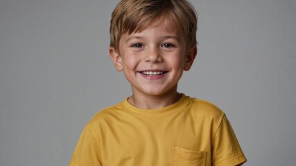 Happy Little boy in yellow clothes smiling portrait
