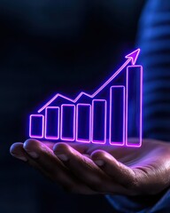 Hand holding a glowing graph symbolizing growth and financial success in the market.