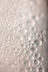 Close Up of Condensation Floating Liquid Water Bubbles and Drips on Glass from Rain