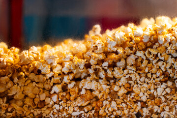 Close-Up of Caramelized Popcorn in a Warm Display Case