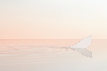 Fototapeta premium soft ripple spreading from single drop in perfectly still body of water