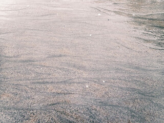 Patterns on the sand of the beach in Koh Chang in Thailand