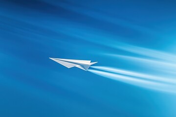 crisp paper airplane mid-flight against bright blue background