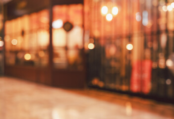 Abstact blurred view of storefront with warm glowing bokeh christmas lighting background