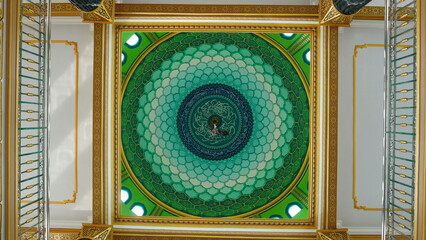 Symmetrical photo shot of the interior of the mosque dome
