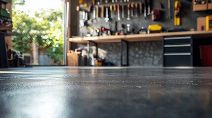 A Close-Up View of a Modern Workshop Floor with Tools and Equipment in the Background, Showcasing a Neat and Organized Garage Space with Natural Light Streaming In