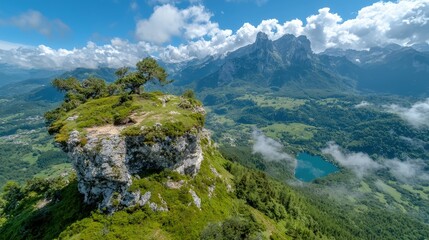 Obraz premium Mountaintop vista rocky outcrop, trees, valley, lake, clouds.