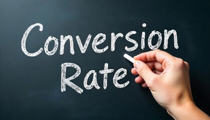 Fototapeta premium Hand holding white chalk writing Conversion Rate.