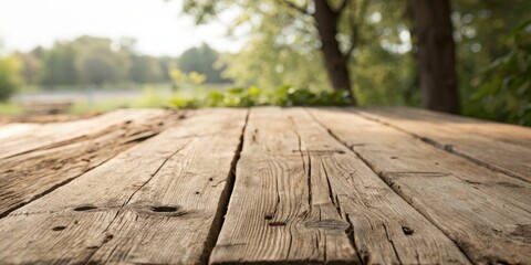 Rustic Wooden Tabletop with Blurred Green Background, Perfect for Displaying Products or Creating a Natural Atmosphere