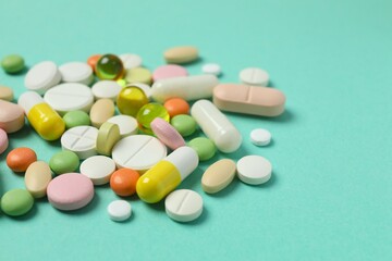 Various pills on a colored background