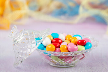 Colorful almond candy. Small colorful candies with almonds inside. (Ramadan holiday) concept. Traditional Easter Portuguese candies. Banner for a confectionery store.