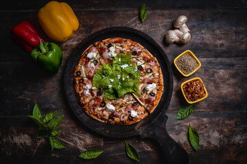 fresh pizza with basil and feta cheese