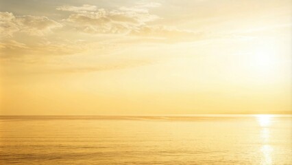 Fototapeta premium A serene seascape at sunset, with golden sunlight reflecting off the calm water and wispy clouds in the sky.